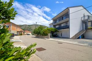 an empty street in a town with a building at FRANKO in Senj