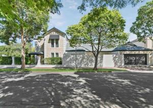a house with a tree in the middle of a street at Executive living in City fringe location in Glenunga