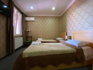 Voodi või voodid majutusasutuse Hotel Shalimar toas