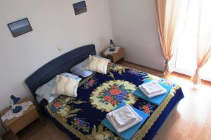 Postel nebo postele na pokoji v ubytování Villa Paladina