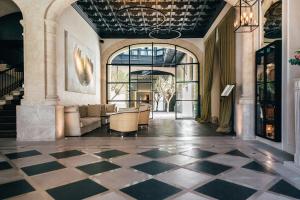 a lobby with a checkered floor at Sant Francesc Hotel Singular in Palma de Mallorca