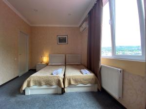 Voodi või voodid majutusasutuse Hotel Shalimar toas