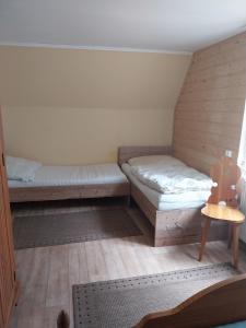 Postel nebo postele na pokoji v ubytování Chata Karlov pod Pradědem. Karlov