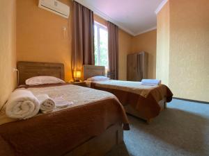 Voodi või voodid majutusasutuse Hotel Shalimar toas