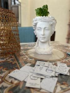 a statue of a bust of a woman on a table at Baglio Mazzara in Custonaci