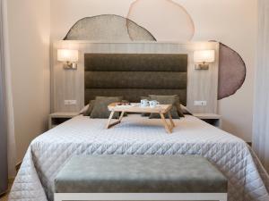 A bed or beds in a room at Versilia Residence - Fronte Mare