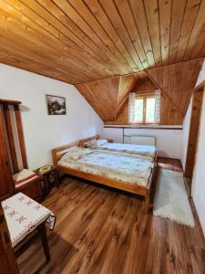 Postel nebo postele na pokoji v ubytování Pensiunea Susman