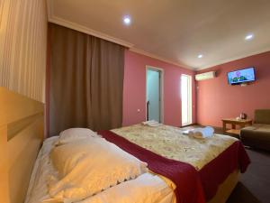 Voodi või voodid majutusasutuse Hotel Shalimar toas