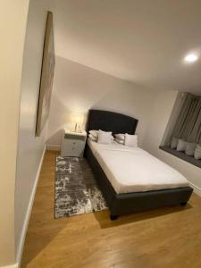 a bedroom with a bed in a room with a window at Apartment X Palm Village Mikocheni in Dar es Salaam +48 photos