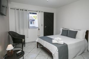 Postel nebo postele na pokoji v ubytování Hotel Pousada Porto da Lua