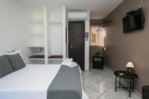 Postel nebo postele na pokoji v ubytování Hotel Pousada Porto da Lua