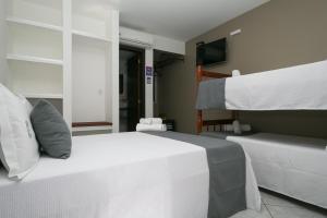 Postel nebo postele na pokoji v ubytování Hotel Pousada Porto da Lua