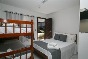 Postel nebo postele na pokoji v ubytování Hotel Pousada Porto da Lua