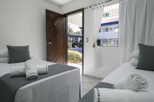 Postel nebo postele na pokoji v ubytování Hotel Pousada Porto da Lua