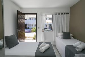 Postel nebo postele na pokoji v ubytování Hotel Pousada Porto da Lua