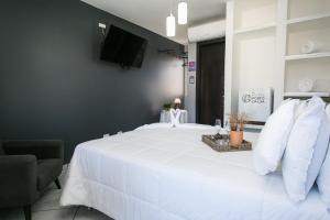 Postel nebo postele na pokoji v ubytování Hotel Pousada Porto da Lua