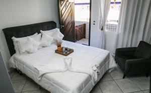 Postel nebo postele na pokoji v ubytování Hotel Pousada Porto da Lua