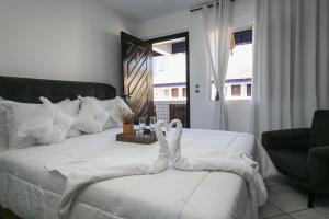 Postel nebo postele na pokoji v ubytování Hotel Pousada Porto da Lua
