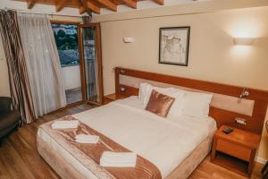 Postel nebo postele na pokoji v ubytování Center Hotel