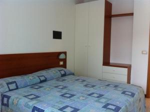 Postel nebo postele na pokoji v ubytování Bibione Residence Apartments