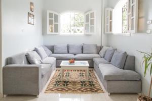a living room with a couch and a table at Villa Rebecca in Luxor +53 photos