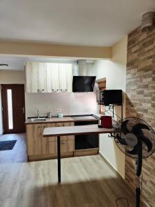 a kitchen with a table in the middle of it at Casa Valentín in Casillas