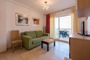TV a/nebo společenská místnost v ubytování Apartamentos Jardines del Mar II