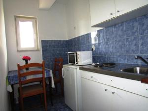 Kuchyň nebo kuchyňský kout v ubytování Villa Paladina