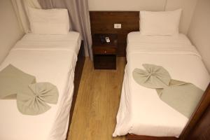 Postel nebo postele na pokoji v ubytování Elysees Hotel Tahrir Square
