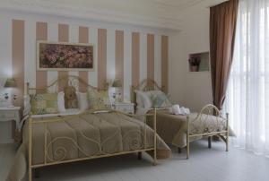 Postel nebo postele na pokoji v ubytování TAM Vacanze B&B