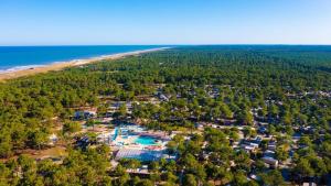 an aerial view of a resort next to the beach at Mobil-Home Camping Club 5* Montalivet in Vendays-Montalivet