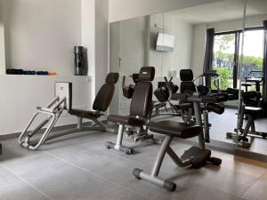 a gym with a bunch of chairs in a room at INSULA FELIX Bed&Breakfast in Moniga