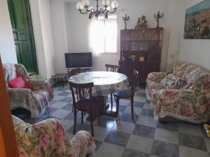 a living room with a table and chairs at Casa Real in Serón