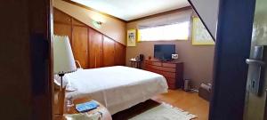 Un pat sau paturi într-o cameră la Casa Amarela