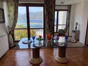 a room with a table with wine glasses on it at La Scalinatella di Mondello in Palermo