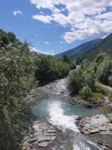 a river in the middle of a valley at Casa Grazia in Lovero Valtellino