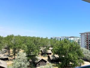 a view of trees and houses in a city at Apartament Hera Mamaia Nord in Năvodari