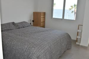 Postel nebo postele na pokoji v ubytování Villa en primera línea de mar con piscina privada + 18 fotografií