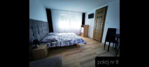 Pokoje Gościnne Gąsowscy Dzieci od 12 roku życia客房内的一张或多张床位