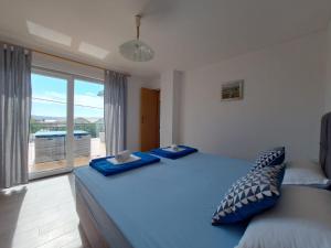 Postel nebo postele na pokoji v ubytování Apartman Klara