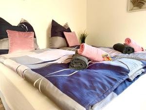 a bed with a blanket on top of it at Zuhause im Ruhrgebiet 2 mit Balkon in Oberhausen
