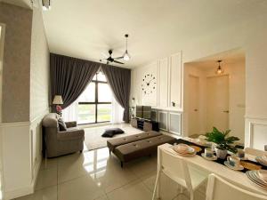 a living room with a couch and a table at The Icon 1 Condo IOI City Mall Putrajaya, Golf View in Putrajaya