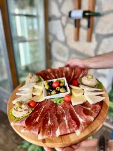 a plate of food with different types of food on it at Apartmani Konoba Starčevo in Virpazar