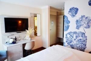 Postel nebo postele na pokoji v ubytování Safranberg Hotel & Sauna