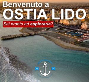 a poster of a beach with an anchor in the water at Appartamento Mykonos in Lido di Ostia