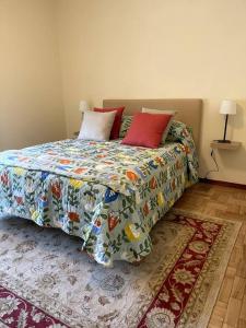 a bed with two pillows on it in a bedroom at Casa das Amigas in Pinhão