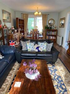 a living room with a couch and a coffee table at Captivating 2-Bed House in Amesbury Salisbury in Amesbury