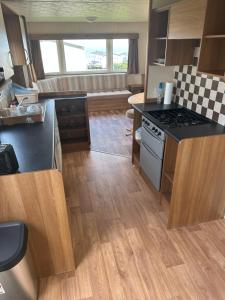 a kitchen with a stove and a counter top at Ocean View B3 in Hartlepool