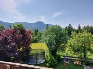 a view of a garden with a playground and trees at Pilzhof in Schleching +10 photos