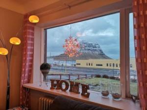 a window with a view of a cruise ship at *Two bathrooms* Beds for 9 pers. Great view in Grundarfjordur